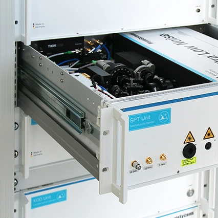 A person opening an drawer of the Menlo Systems' ORS system rack